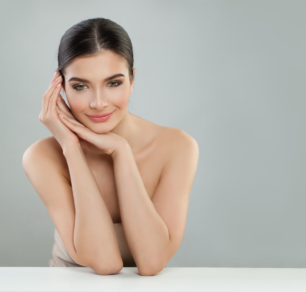 Happy young woman smiling. Facial treatment, aesthetic medicine and skincare